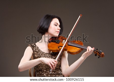 Girl with violin in gold dress