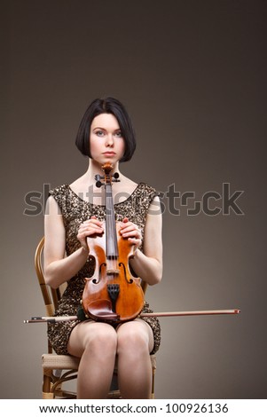 Girl with violin in gold dress
