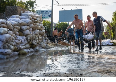 DONETSK, UKRAINE - JUNE 01: Captured marauders working at the Russian Orthodox Army\'s block post on the road to the airport on june 01, 2014 in Donetsk.