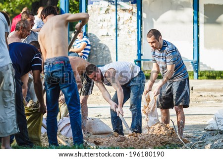 DONETSK, UKRAINE - JUNE 01: Captured marauders working at the Russian Orthodox Army\'s block post on the road to the airport on june 01, 2014 in Donetsk.