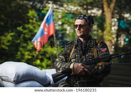 DONETSK, UKRAINE - JUNE 01: One of the fighters at the Russian Orthodox Army\'s block post on the road to the airport on june 01, 2014 in Donetsk.