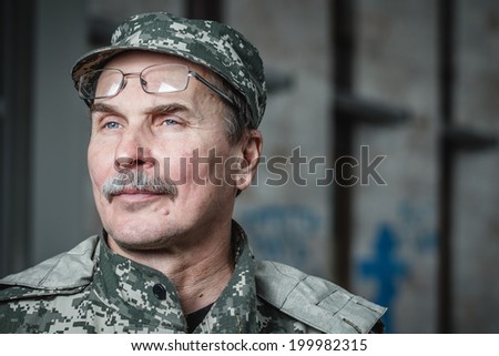 DONETSK, UKRAINE - JUNE 21: Portrait of Deputy Commander of the militia Fedor Berezin with the Donetsk Regional State Administration on background on june 21, 2014 in Donetsk.