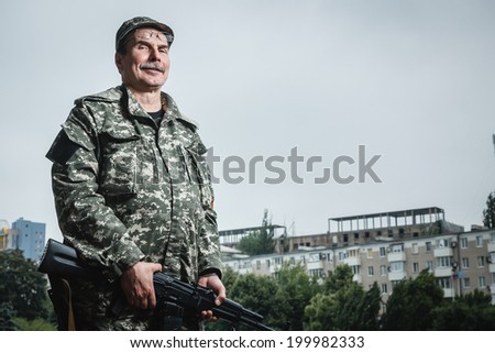 DONETSK, UKRAINE - JUNE 21: Portrait of Deputy Commander of the militia Fedor Berezin near the Donetsk Regional State Administration on background on june 21, 2014 in Donetsk.