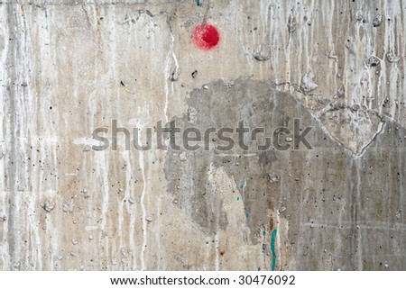 Weathered damaged wall with red dot