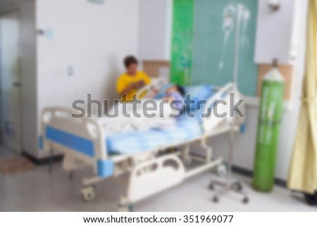 Blurred image of a patient lying on a bed in the hospital for IV use background.