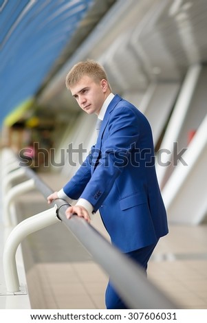 Handsome and attractive businessman in suit, Business Centre Moscow City, Bagration Bridge