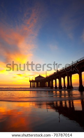 Beautiful sunset over a pier in the city of Los Angeles.