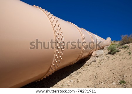 Pipeline in the Mojave Desert, California carrying oil.