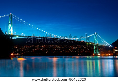 The Lion\'s Gate Bridge in Vancouver, British Columbia during an evening blue hour.