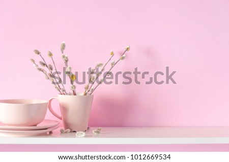 Verba, willow fur seals in a vase on a pink wall background and on a white shelf. Home light decor. Valentine\'s Day, Easter, Mother\'s Day Background.