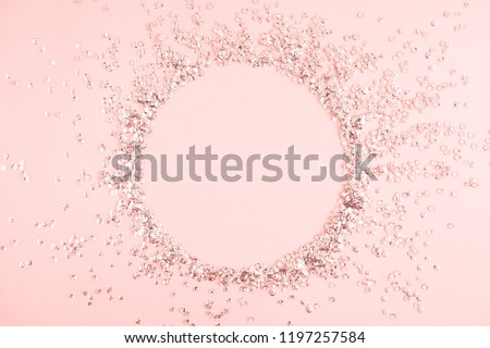 Festive pink background. Shining sequins on light pink pastel background. Christmas. Wedding. Birthday. Happy woman\'s day. Mothers Day. Valentine\'s Day. Flat lay, top view, copy space.