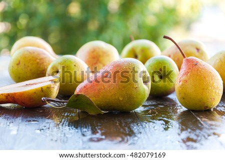 Fresh ripe organic pears on rustic wooden table, natural background, vega, diet food
