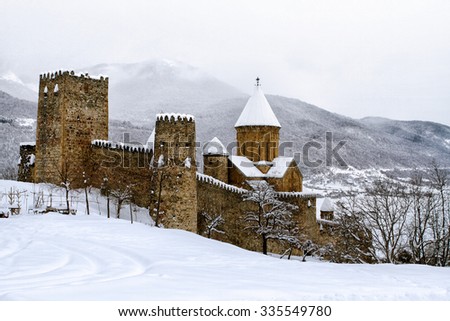 Ancient Georgian church covered by snow