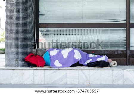 Homeless. Homeless barefooted woman sleep on the street. Social documentary street.