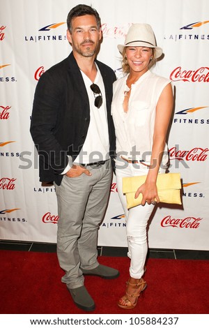 WOODLAND HILLS, CA - JUNE 02: Actor Eddie Cibrian (L) and his wife recording artist LeAnn Rimes arrives at the grand opening of the LA Fitness Signature Club on June 2, 2012 in Woodland Hills.