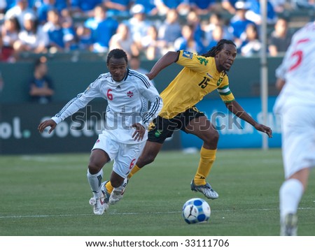 CARSON, CA. - JULY 3: Concacaf Gold Cup soccer match, Canada vs. Jamaica at the Home Depot center in Carson. Ricardo Gardner and Julian De Guzman running down the ball on July 3, 2009.