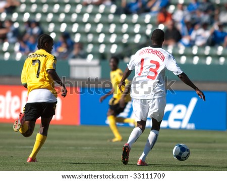 CARSON, CA. - JULY 3: Concacaf Gold Cup soccer match, Canada vs. Jamaica at the Home Depot center in Carson. Atiba Hutchinson and Jason Morrison making a move for the ball on July 3, 2009.