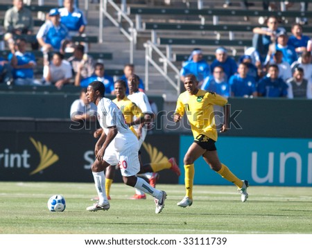 CARSON, CA. - JULY 3: Concacaf Gold Cup soccer match, Canada vs. Jamaica at the Home Depot center in Carson. Patrice Bernier dribbles the bal away from Rodolph Austin on July 3, 2009.