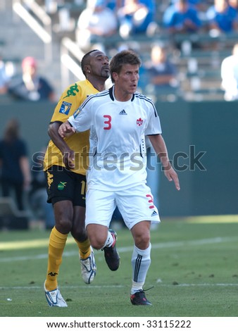 CARSON, CA. - JULY 3: Concacaf Gold Cup soccer match, Canada vs. Jamaica at the Home Depot center in Carson. Ricardo Fuller and Michael Klukowski fighting for the ball on July 3, 2009.