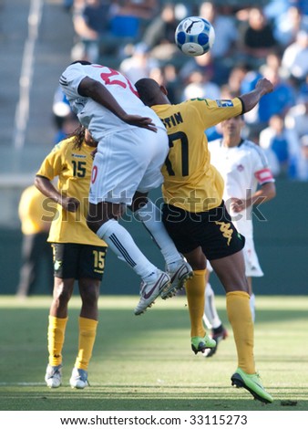 CARSON, CA. - JULY 3: Concacaf Gold Cup soccer match, Canada vs. Jamaica at the Home Depot center in Carson. Rodolph Austin and Patrice Bernier making a move for the ball on July 3, 2009.