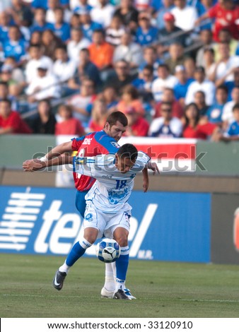 CARSON, CA. - JULY 3: Concacaf Gold Cup soccer match, Costa Rica vs. El Salvador at the Home Depot center in Carson. Gonzalo Segarews and Salvador Coreas fighting for the ball on July 3, 2009.