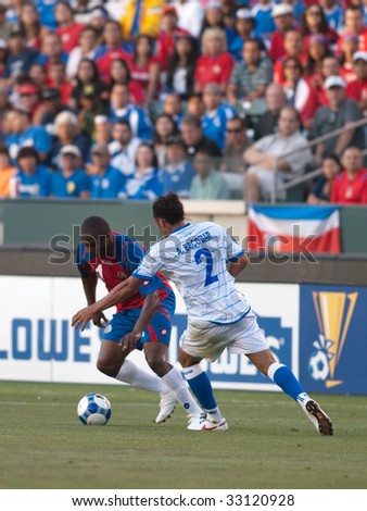 CARSON, CA. - JULY 3: Concacaf Gold Cup soccer match, Costa Rica vs. El Salvador at the Home Depot center in Carson. Froylan Ledezma trying to get past Alexander Escobar on July 3, 2009.