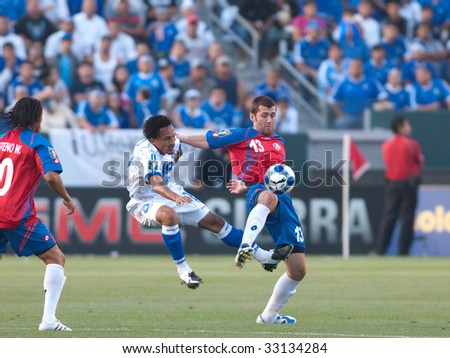CARSON, CA. - JULY 3: Concacaf Gold Cup soccer match, Costa Rica vs. El Salvador at the Home Depot Center in Carson. Gonzalo Segarews and William Reyes fight for the ball. July 3, 2009.