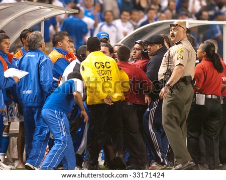 CARSON, CA. - JULY 3: Concacaf Gold Cup soccer match, Costa Rica vs. El Salvador at the Home Depot Center in Carson. Spectator on the field starts a fight. July 3, 2009.