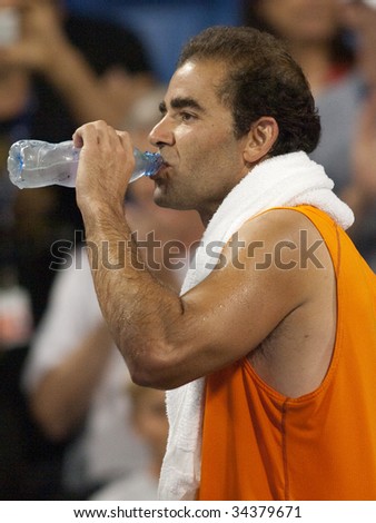 LOS ANGELES, CA. - JULY 27: Pete Sampras taking a drink after an exhibition match at the L.A. Tennis Open July 27th 2009 in Los Angeles.