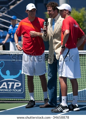 LOS ANGELES, CA. - AUGUST 2: Bob Bryan (L) and Mike Bryan (R) being interviewed by Tennis Channel at the mens doubles final of the L.A. Tennis Open August 2, 2009 in Los Angeles.