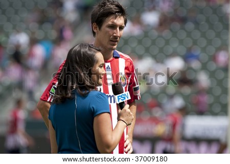 CARSON, CA. - SEPTEMBER 13: Sacha Kljestan interviewed by Amanda Fletcher during half time of the Chivas USA vs. New England Revolution match  at the Home Depot Center on September 13, 2009 in Carson.