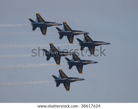 SAN FRANCISCO, CA. - OCTOBER 10: Blue Angels flying in a tightly grouped formation over the bay area during Fleet Week on October 10th 2009 in San Francisco, CA.