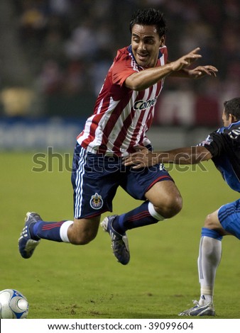CARSON, CA. - OCTOBER 17: Jesus Padilia getting tripped up during the Chivas USA vs. San Jose Earthquakes match on October 17th 2009 at the Home Depot Center in Carson.