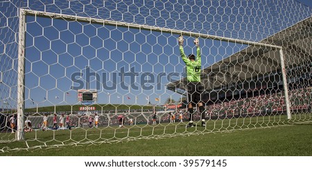 CARSON, CA. - OCTOBER 25: Pat Onstad (mid) gets ready to stop Eduardo Lillingston\'s penalty shot during Chivas USA vs. Houston Dynamo match on October 25th, 2009 at the Home Depot Center in Carson.