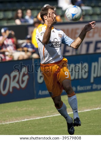 CARSON, CA. - OCTOBER 25: Brian Mullan cheast traps the ball during the Chivas USA vs. Houston Dynamo match on October 25th, 2009 at the Home Depot Center in Carson.