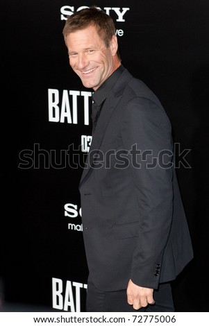 WESTWOOD, CA. - MARCH 8: Aaron Eckhart arrives at Columbia Pictures premiere of Battle: Los Angeles on March 8th 2011 at the Regency Village Theater in Westwood, Ca.