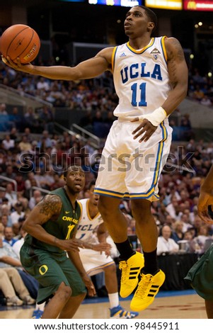 LOS ANGELES - MARCH 10: UCLA Bruins G Lazeric Jones #11 lays the ball up during the NCAA Pac-10 Tournament basketball game on March 10 2011 at Staples Center.