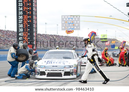FONTANA, CA. - MARCH 27: Travis Kvapil driver of the #38 Long John Silver\'s Ford pits during the NASCAR Sprint Cup Series Auto Club 400 on March 27 2011 at Auto Club Speedway.