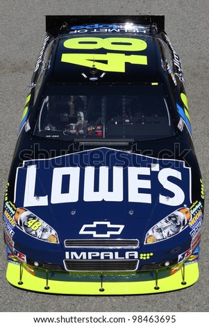 FONTANA, CA. - OCT 9: Sprint Cup Series driver Jimmie Johnson in the Lowe\'s #48 car during the Pepsi Max 400 practice on Oct 9 2010 at the Auto Club Speedway.