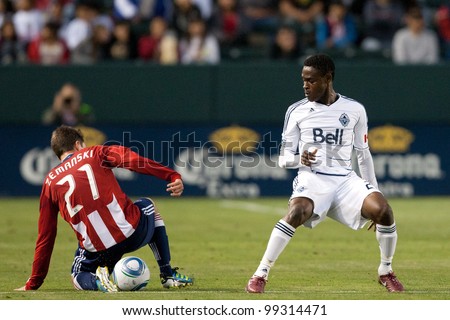 CARSON, CA. - JUNE 1: Chivas USA player M Ben Zemanski #21 (L) & Vancouver Whitecaps FC player M Gershon Koffie #28 (R) during the MLS game on June 1 2011 at the Home Depot Center in Carson, CA.