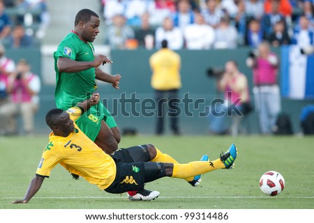CARSON, CA. - JUNE 6: Jamaica player D Dicoy Williams #3 (F) slide tackles Grenada player F Delroy Facey #8 (B) in action during the 2011 CONCACAF Gold Cup group B game on June 6 2011 at the Home Depot Center in Carson, CA.