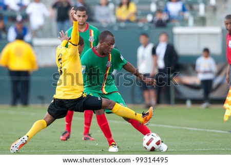 CARSON, CA. - JUNE 6: Jamaica player D Eric Vernan #8 (L) & Grenada player D Anthony Straker #15 (R) in action during the 2011 CONCACAF Gold Cup group B game on June 6 2011 at the Home Depot Center in Carson, CA.