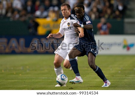 CARSON, CA - MAY 14: Los Angeles Galaxy F player Chad Barrett #11 (L) & Sporting Kansas City F player Kei Kamara #23 (R) during the MLS game on May 14,. 2011 at the Home Depot Center in Carson, CA.