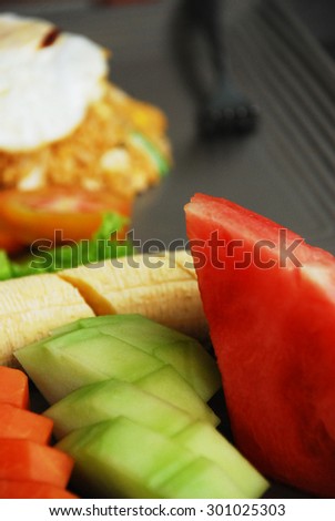 Watermelon, Banana, Papaya Melon Sliced on a Plate.. Fresh & Healthy Breakfast with Fruit..