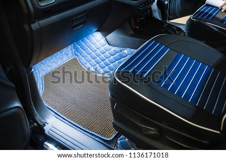 Rubber floor mat in car.