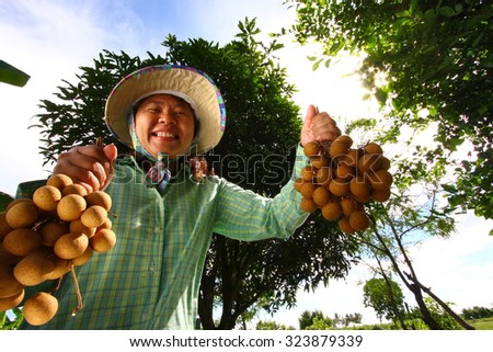 Longan farmer with smile. Welcome to taste, Thailand.