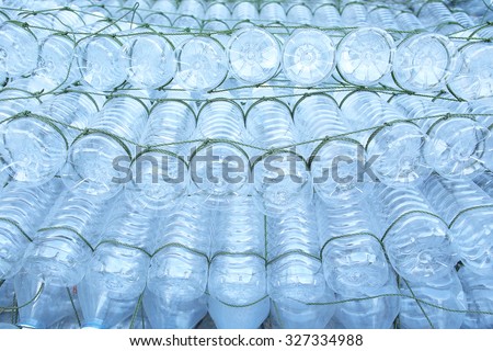 Reuse : Plastic bottle raft substitute for boat. selective focus