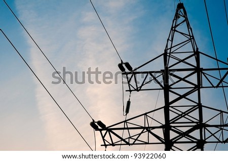 Electric high voltage tower with sky background
