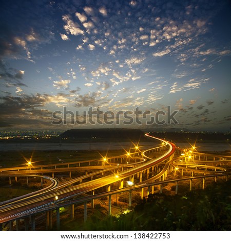 Highway in night with cars light in modern city in Taiwan, Asia.