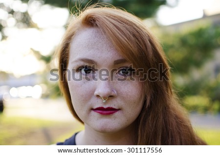 Red headed woman with nose ring